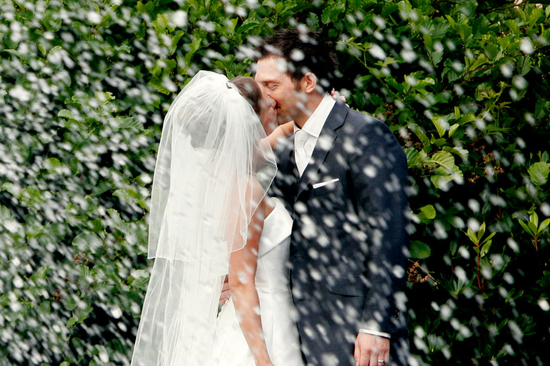 close up newly wed couple kissing jacqueline kennedy wedding planner